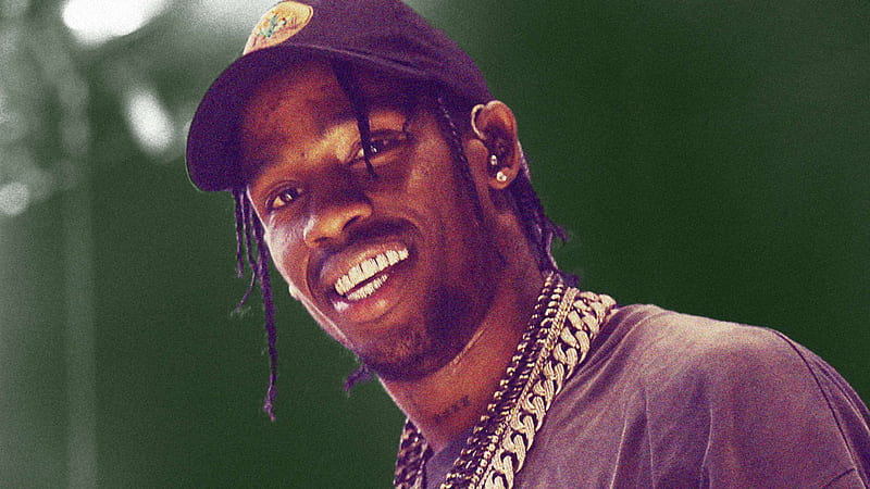 Travis Scott Is Wearing Black Dress And Cap And Silver Chains On