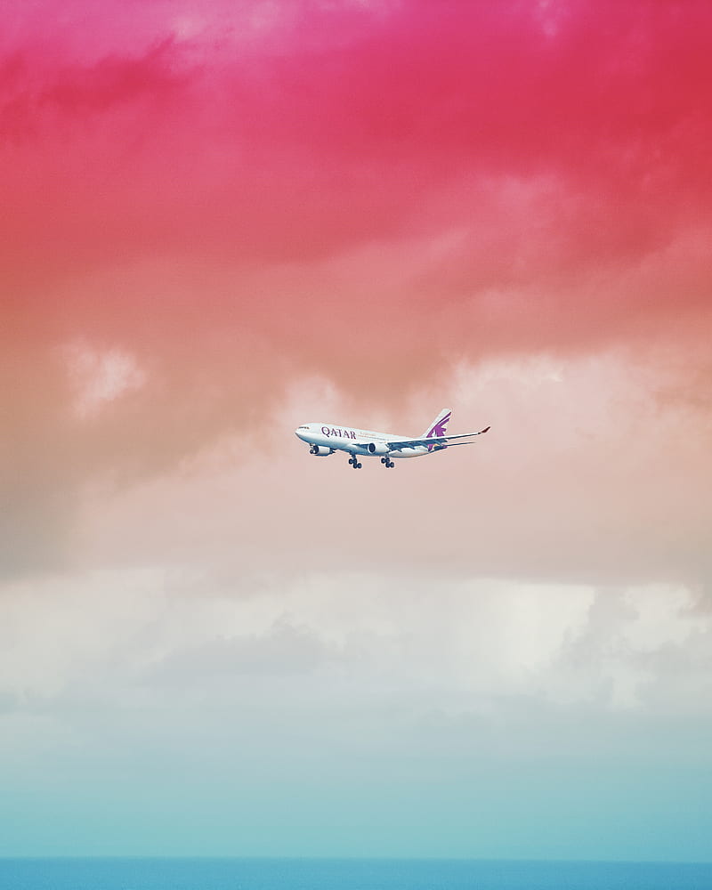 Qatar Airlines airplane flying under red cloud formation, HD phone wallpaper