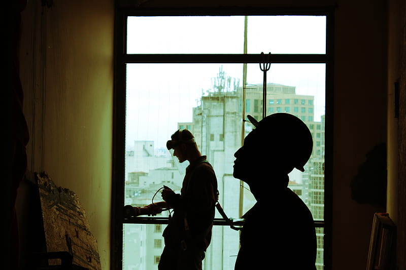 two men wearing hard hat standing near clear glass window, HD wallpaper