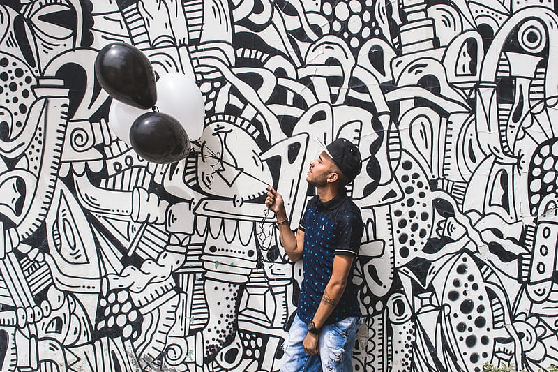 man holding two black balloons, HD wallpaper