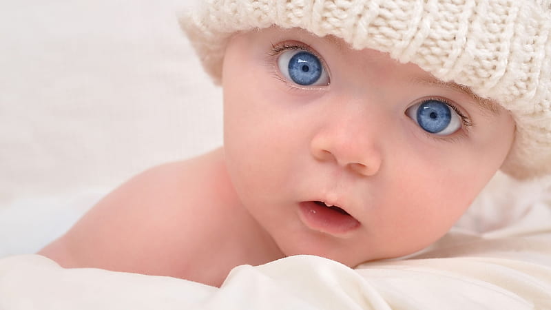 cute ash eyes baby is lying down on bed wearing white knit cap cute, HD wallpaper