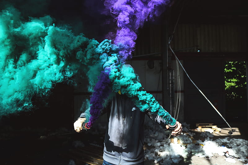 person holding purple and green smoker bottle during daytime, HD wallpaper
