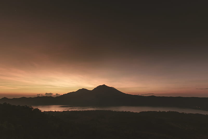 silhouette of mountain near body of water under brown clouds, HD wallpaper