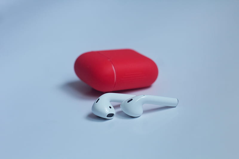 white wireless earbuds with red charging case on white surface, HD wallpaper