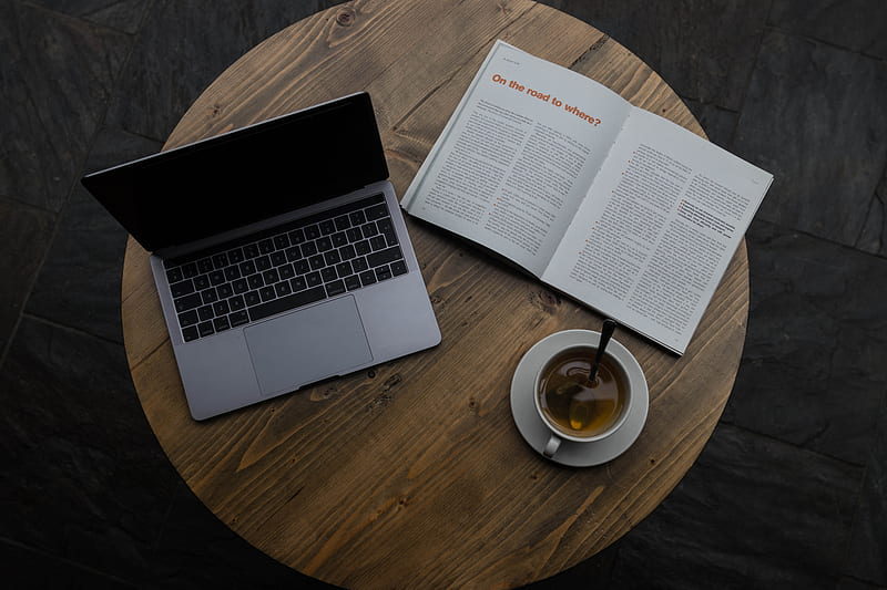 gray laptop beside white teacup and book, HD wallpaper