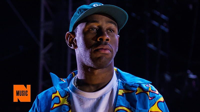 Tyler The Creator Is Wearing Blue Shirt And Cap Looking Side In A Black Background Music, HD wallpaper