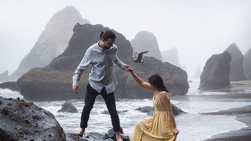 Couple In Gray Shirt Black Pant Yellow Dress Is Standing On Rock Near Body Of Water During Daytime Couple, HD wallpaper