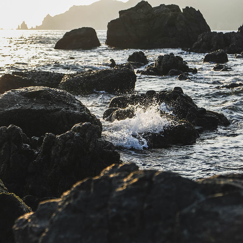 Black rock formation on sea during daytime, HD phone wallpaper | Peakpx