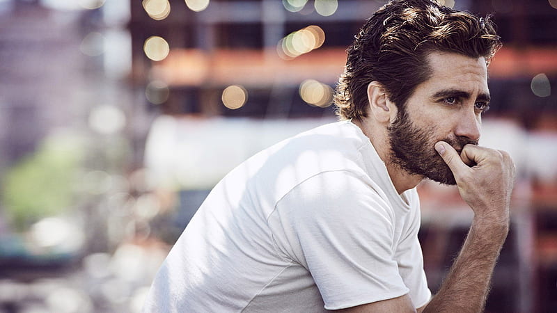 Jake Gyllenhaal Is Wearing White T-shirt Having Hand On Mouth In Blur Glittering Background Celebrities, HD wallpaper