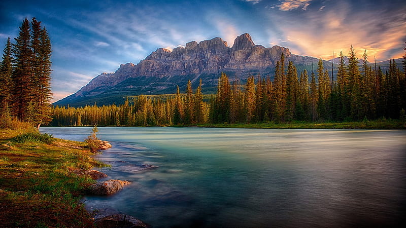 Landscape View Of Mountain Under Blue Sky And River Surrounded By