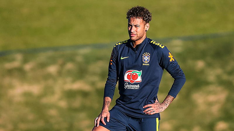 Neymar Da Silva Santos Junior Is Standing In Blur Green Grass Background Wearing Blue Sports