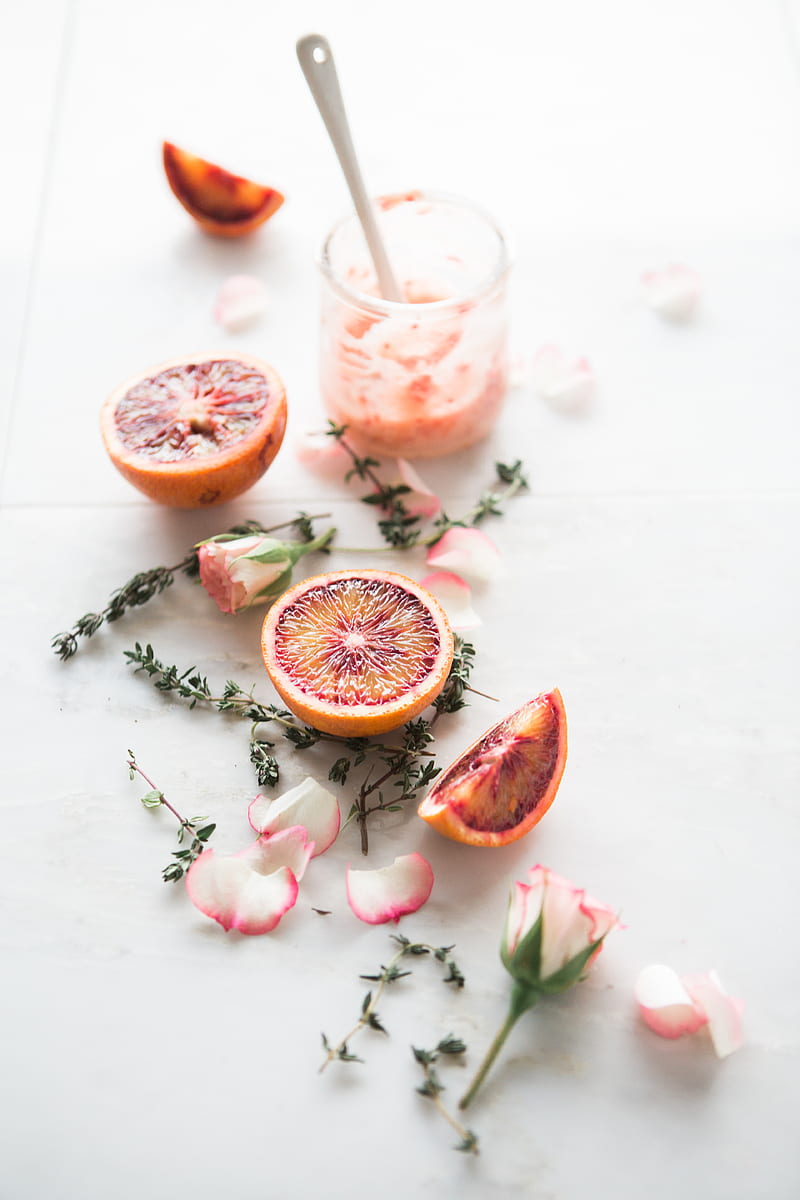 sliced blood orange fruits with white-and-pink petaled flowers beside, HD phone wallpaper