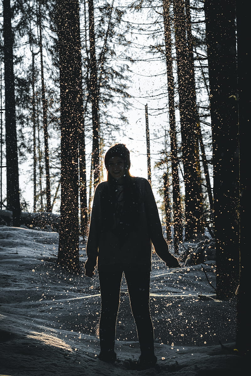 Forest stand. Woman standing Forest. A Human in Suit turned back standing in the Forest.