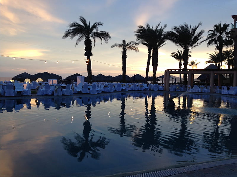Sun setting on the Royal Solaris, Los Cabos, Mexico, vacation, ocean, royal solaris, sky, palm trees, beach, mexico, reflections, los cabos, HD wallpaper