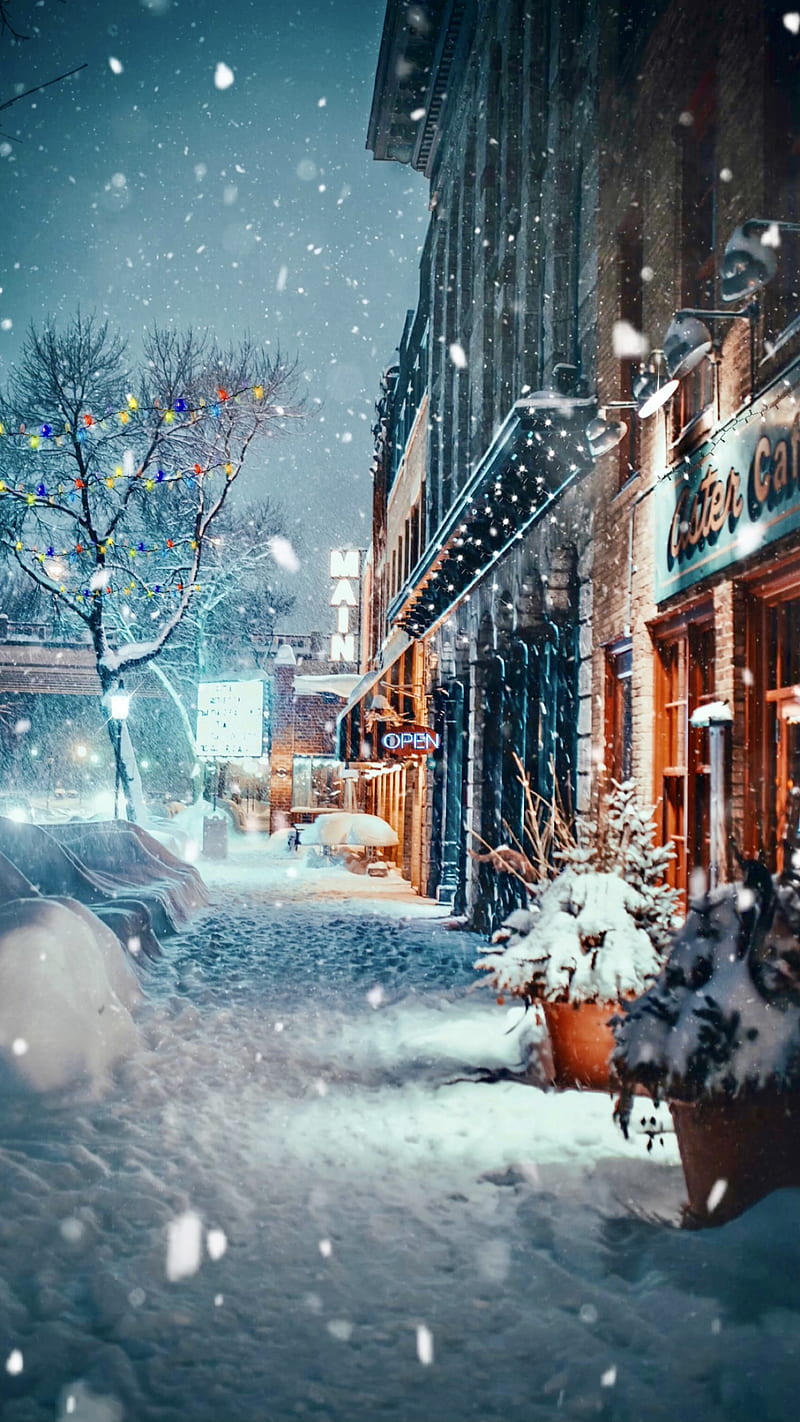 “Holiday Lights”, Christmas lights, Christmas time, ColetteLrsn, cozy scene, festive, holiday lights, small town street, snow, snow falling, storefront, winter evening, winter scene, HD phone wallpaper