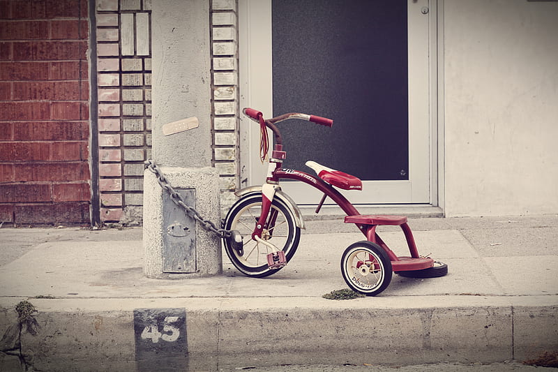 red and white Radio Flyer trike chained on stone post, HD wallpaper