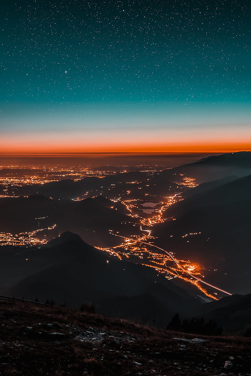 night city, aerial view, mountains, lights, starry sky, HD phone wallpaper