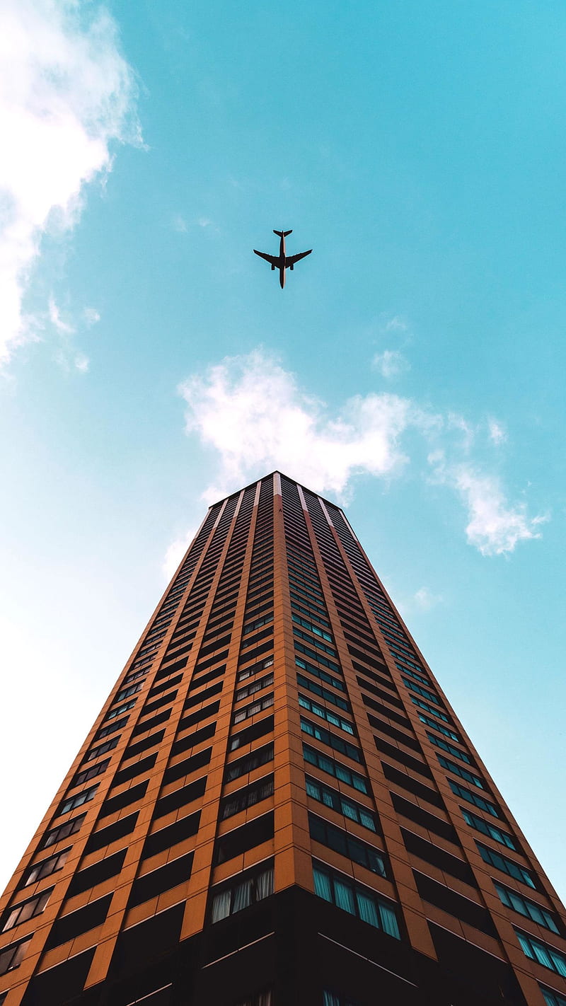 Plane in the Sky , building, planes, flying machine, HD phone wallpaper