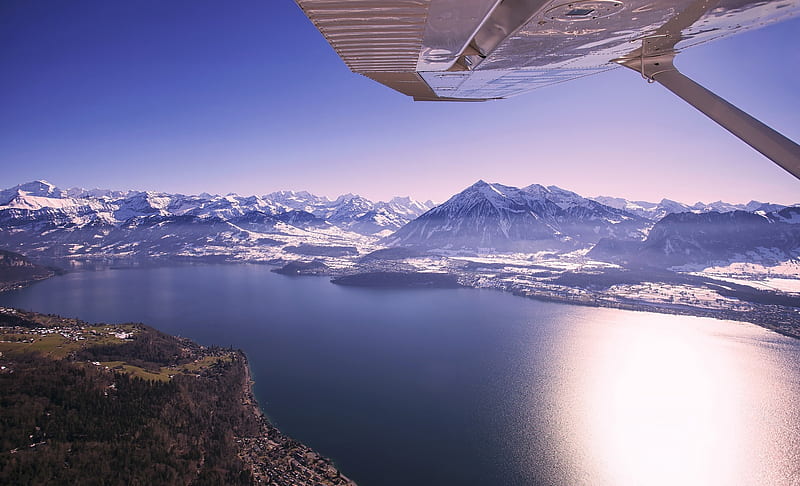 View from an airplane over a mountainside lake, wet, cloud, wing, sky, clouds, lake, mountain, water, plane, airplane, snow, mountains, coast, blue, HD wallpaper