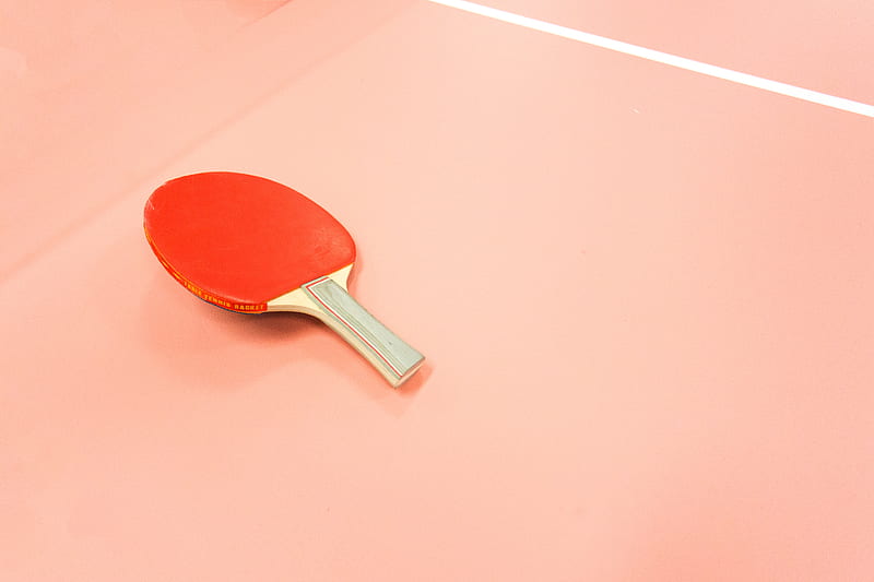 A red table tennis paddle sitting on a court., HD wallpaper