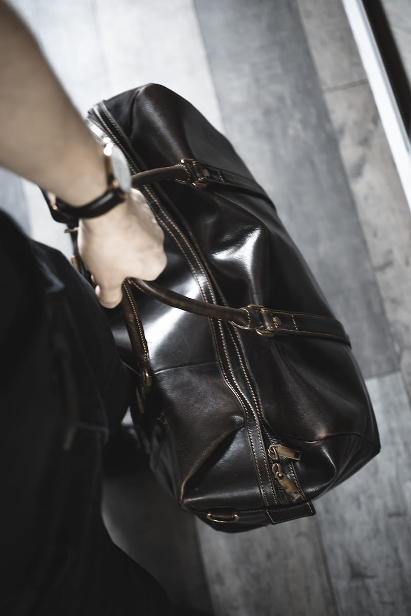 Person holding brown leather handbag, HD phone wallpaper | Peakpx