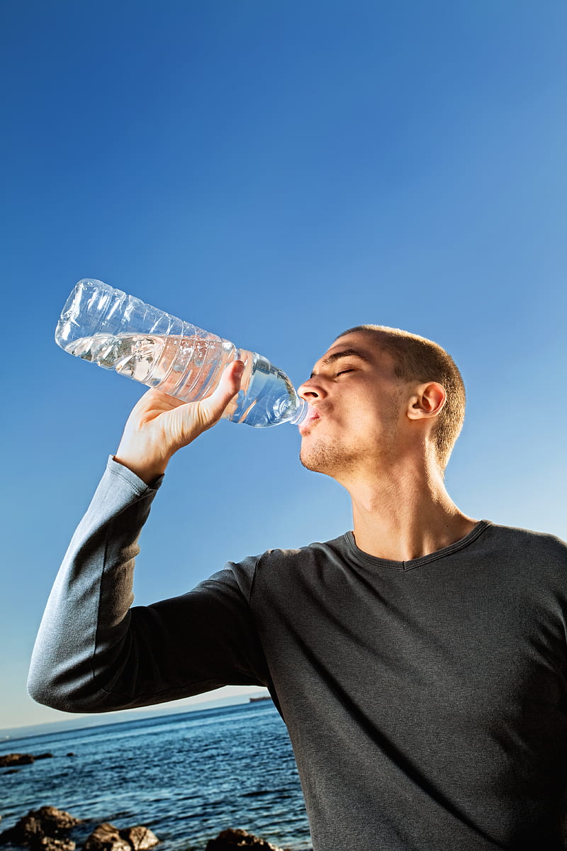 man in black crew neck shirt drinking water, HD phone wallpaper