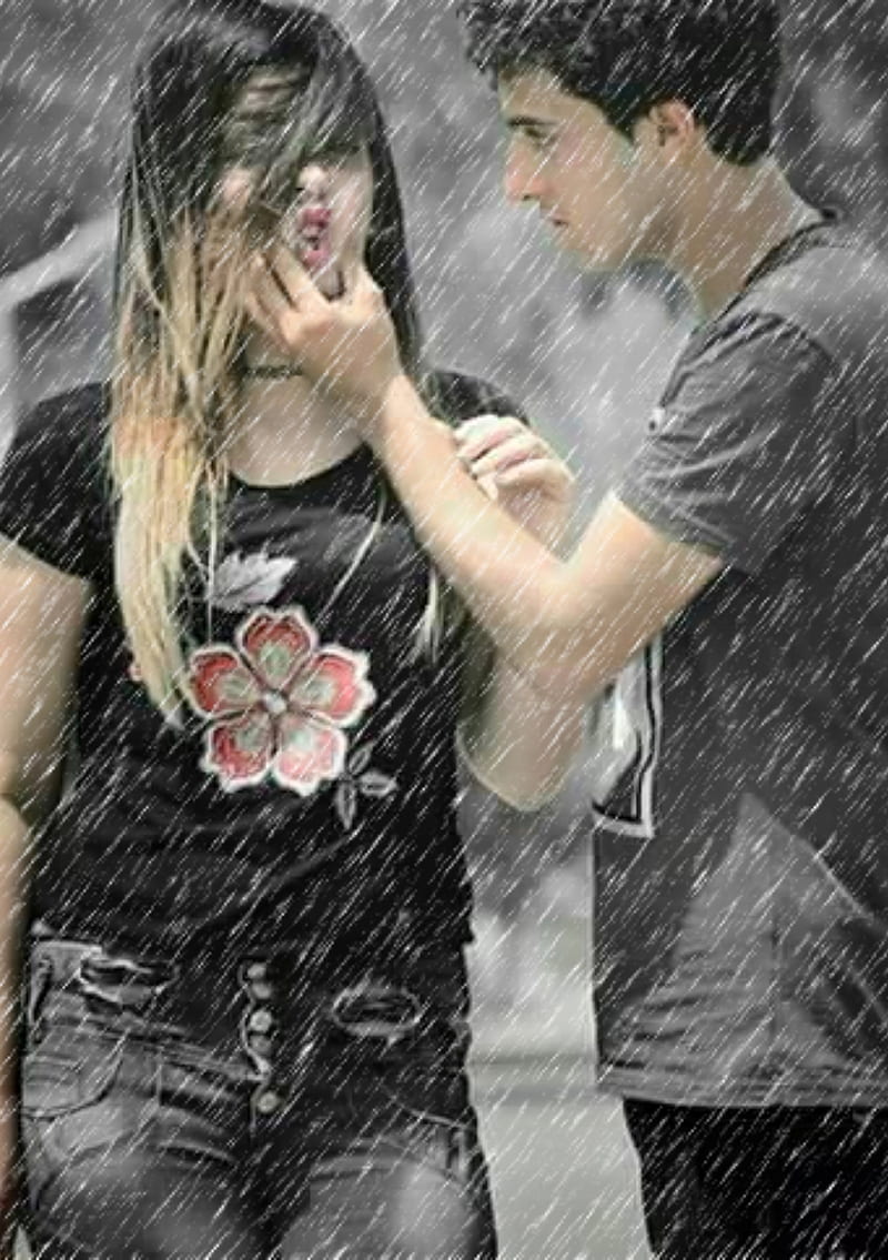 boy and girl hugging in the rain