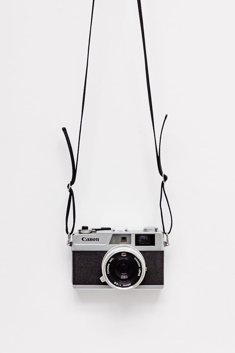 black and gray Canon camera on white surface, HD phone wallpaper