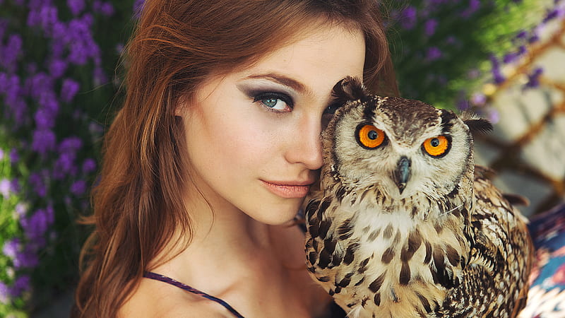 Girl Model With Owl Bird Is Standing In Purple Flowers Background Girls ...