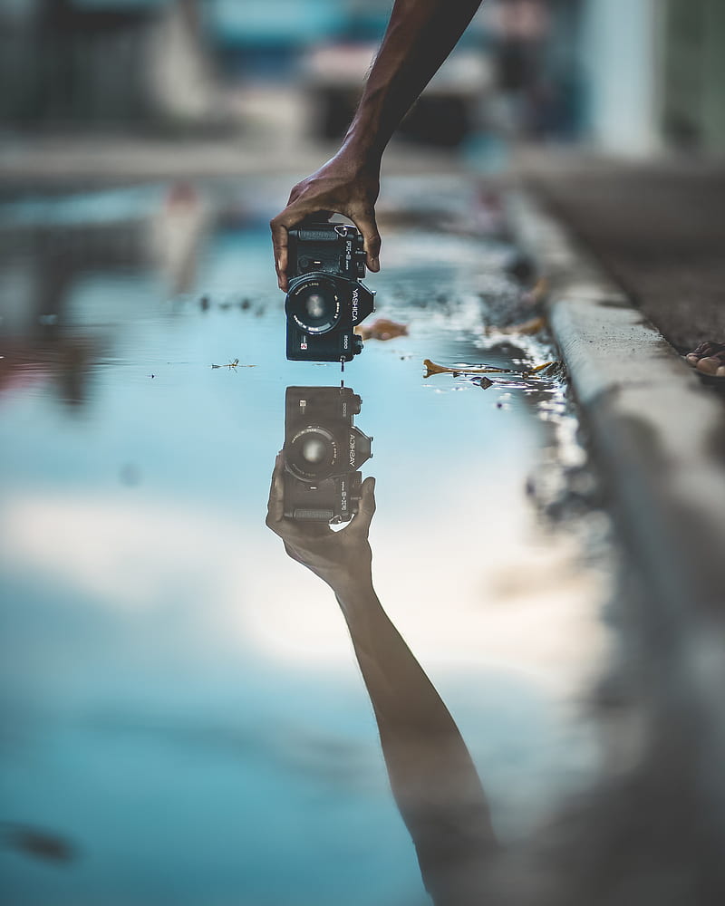 mirror graphy of person holding DSLR camera with water reflection, HD phone wallpaper