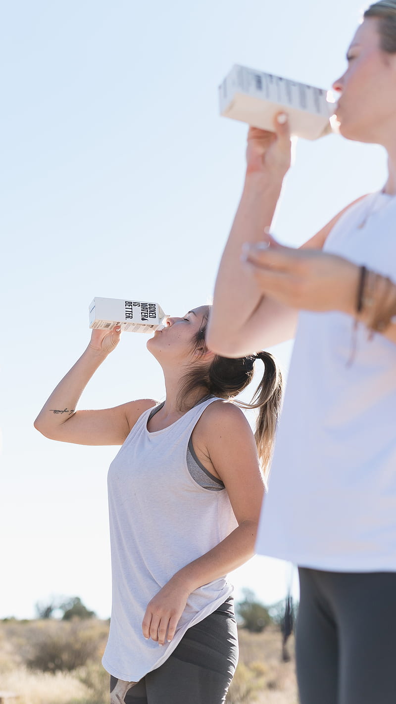 Two women working out and drinking Boxed Water, HD phone wallpaper
