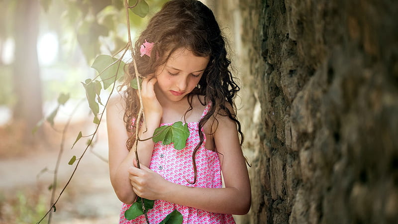 Blonde Cute Little Girl Is Looking Down Wearing Pink Flower Printed Dress In Forest Background Cute, HD wallpaper