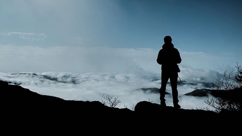 Sad Looking Man Is Standing Alone On Rock Edge In White Clouds Sky Background Alone, HD wallpaper