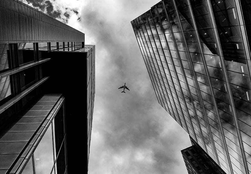 Plane Between Two Buildings Monochrome, plane, building, graphy, monochrome, black-and-white, flickr, HD wallpaper