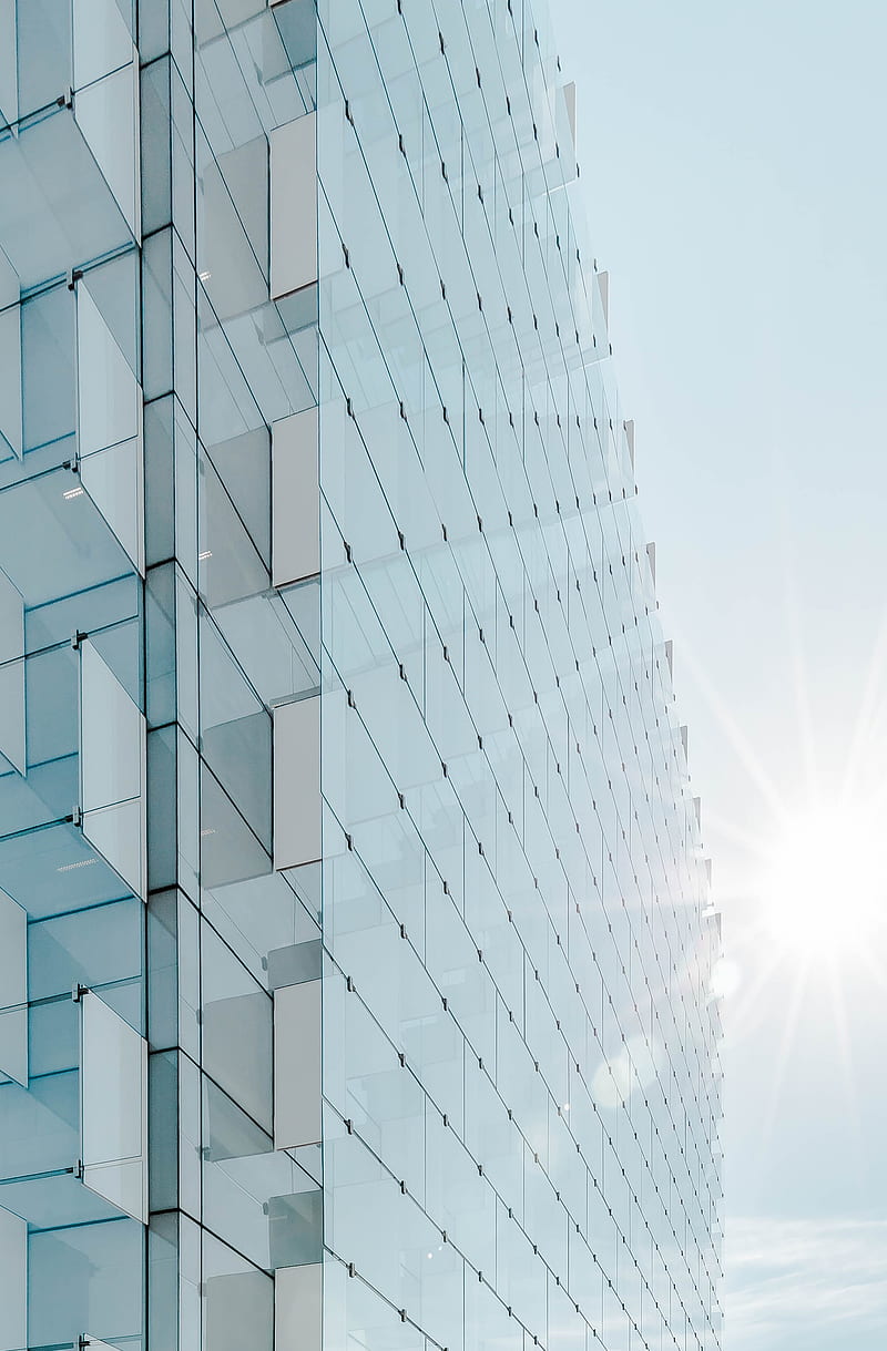 glass panel high-rise building under blue sky with sun raise, HD phone wallpaper