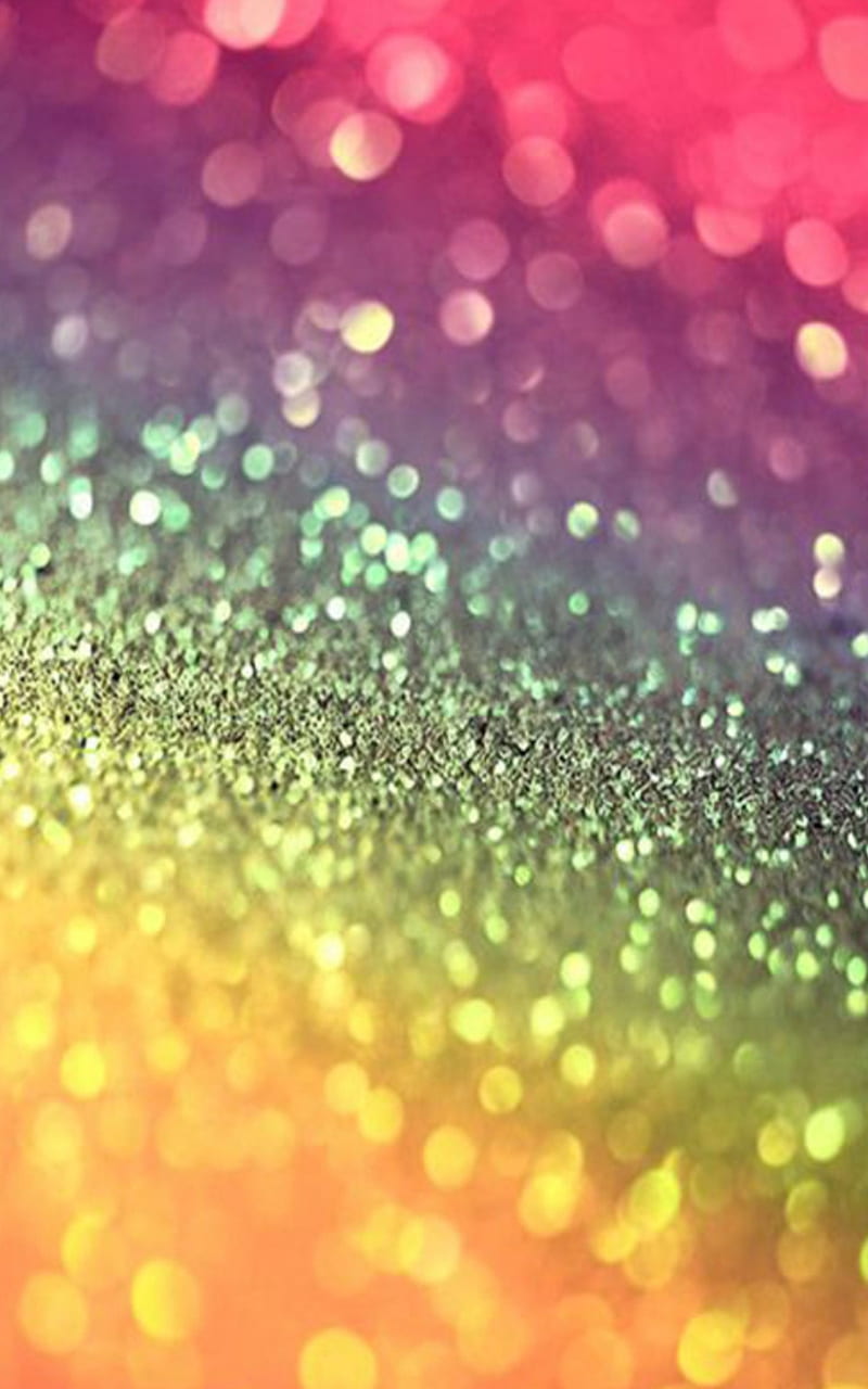 Download “A beautiful view of a rainbow of glitter shining in the sun”  Wallpaper | Wallpapers.com