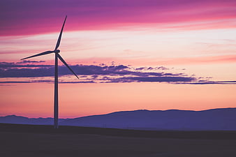 Premium Vector  Minimalist mobile wallpaper with wind turbines and trees  with a sunset