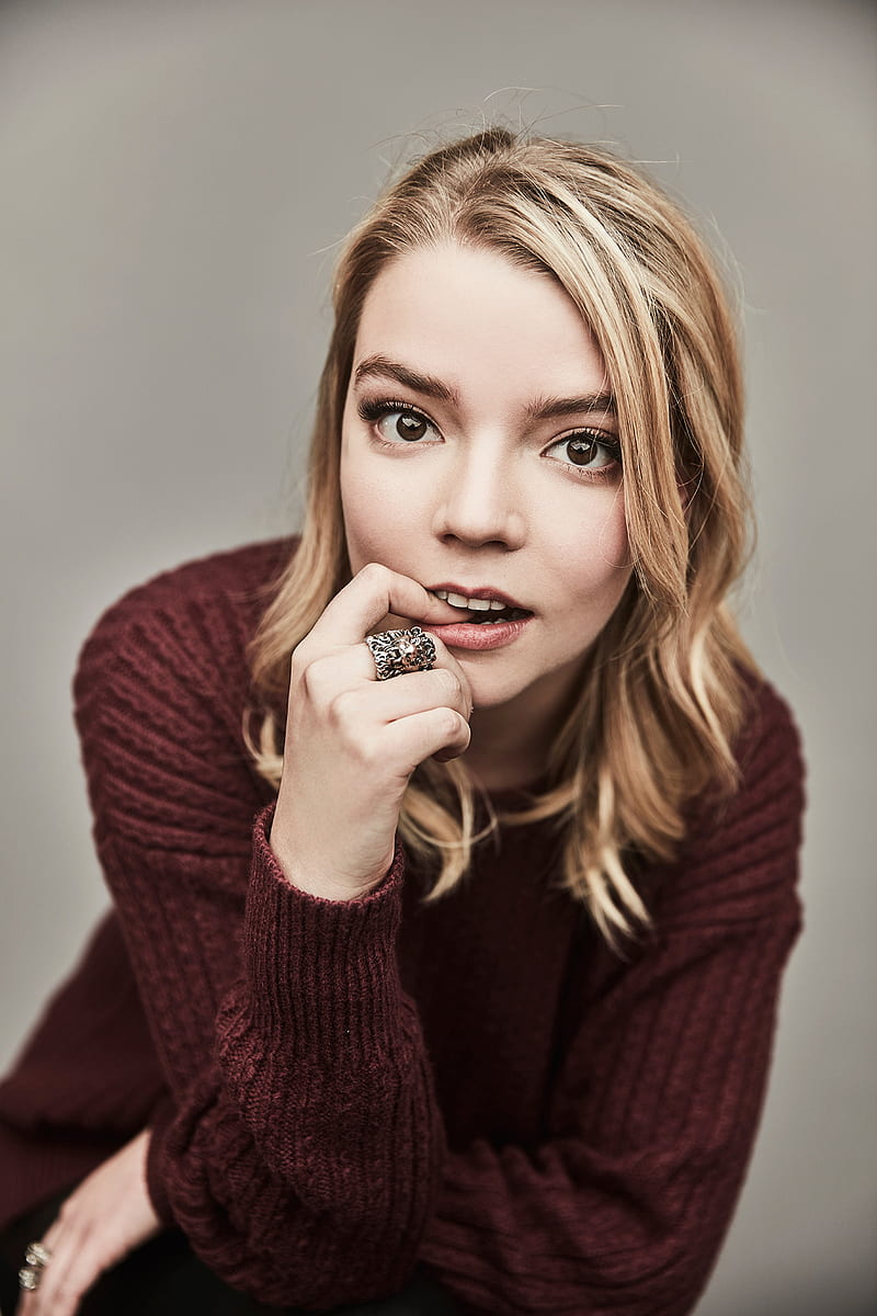 Anya Taylor-Joy, women, actress, blonde, sweater, simple background, finger  in mouth, HD phone wallpaper | Peakpx