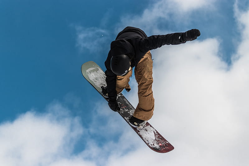 man in black jacket and brown pants riding white and red snowboard, HD wallpaper