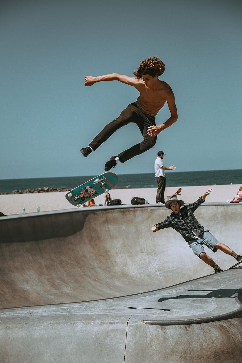 two men skateboarding on bowl ramp, HD phone wallpaper