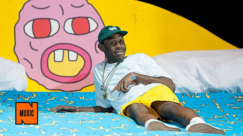 Tyler The Creator Is Lying On Blue Bed Wearing White Tshirt And Yellow Shorts Posing For A Music, HD wallpaper