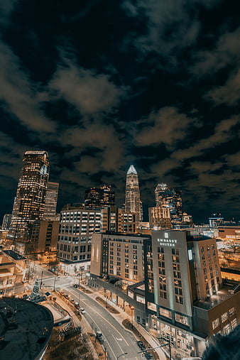 City buildings under dark clouds during night time, HD phone wallpaper |  Peakpx