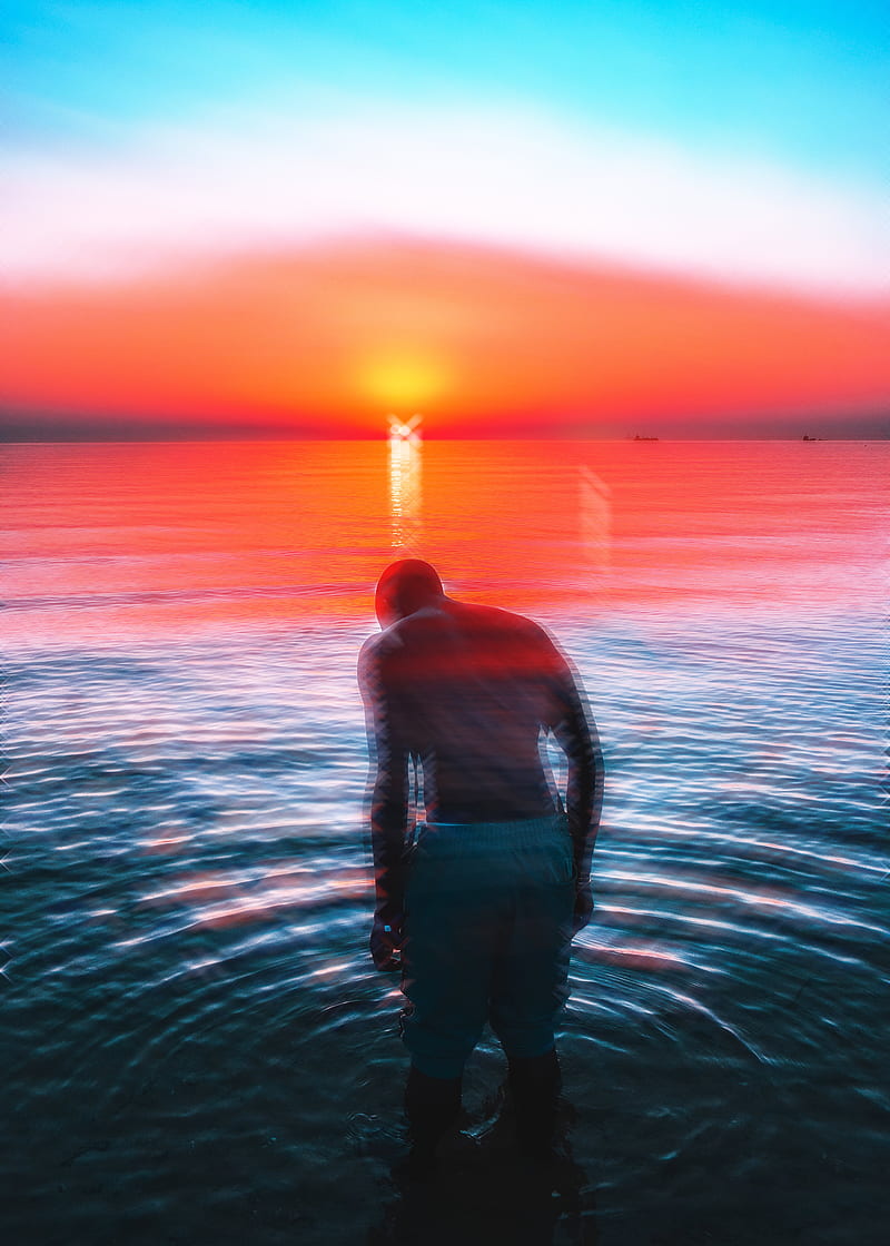 man in black tank top standing on water during sunset, HD phone wallpaper
