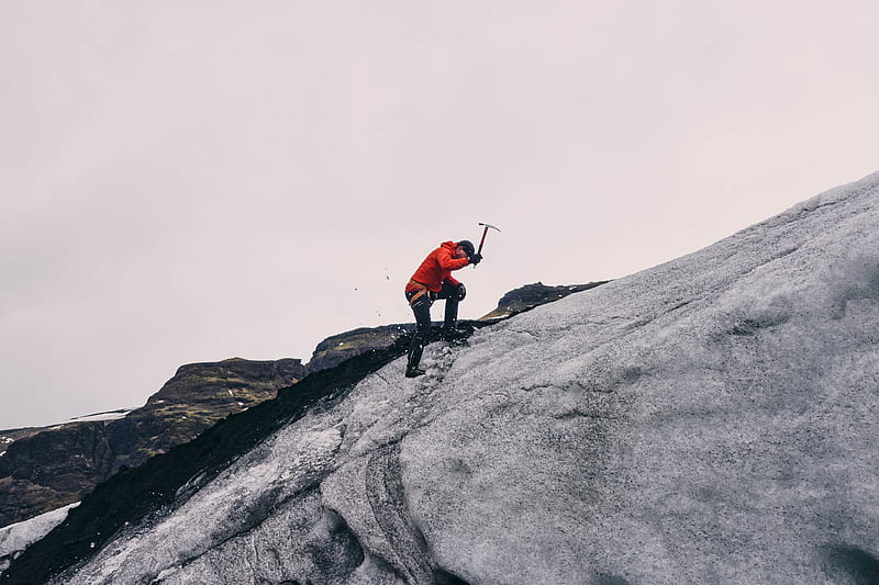 man climbing on mountain during daytime, HD wallpaper