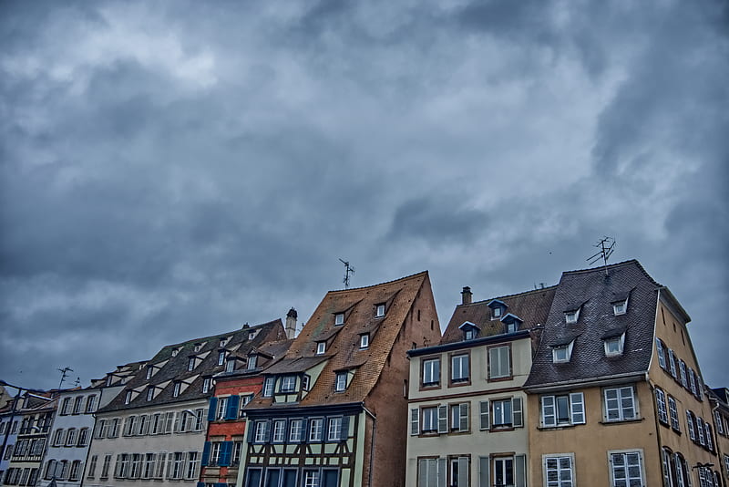 grey clouds hovering above rows of apartment building, HD wallpaper