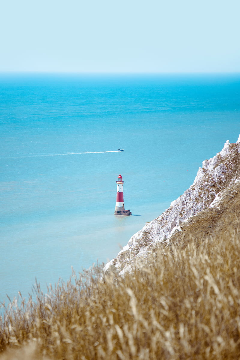 lighthouse, building, boat, sea, grass, horizon, HD phone wallpaper
