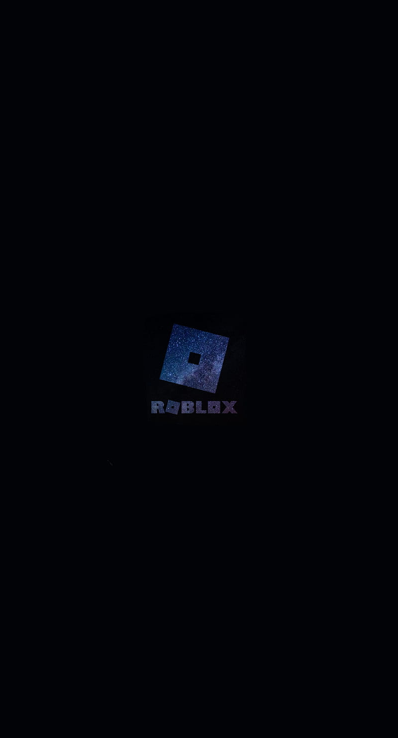 Foto de Roblox logo and application on the mobile screen. Roblox
