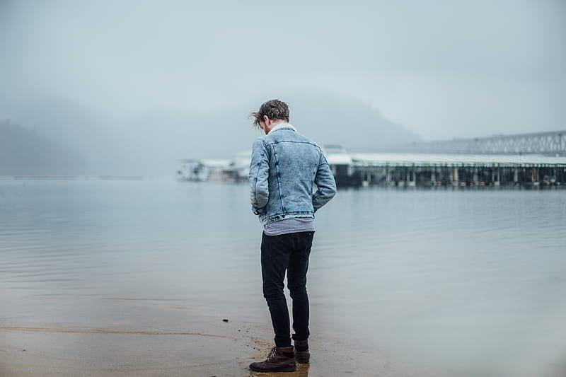 man in blue denim jacket standing on shore, HD wallpaper
