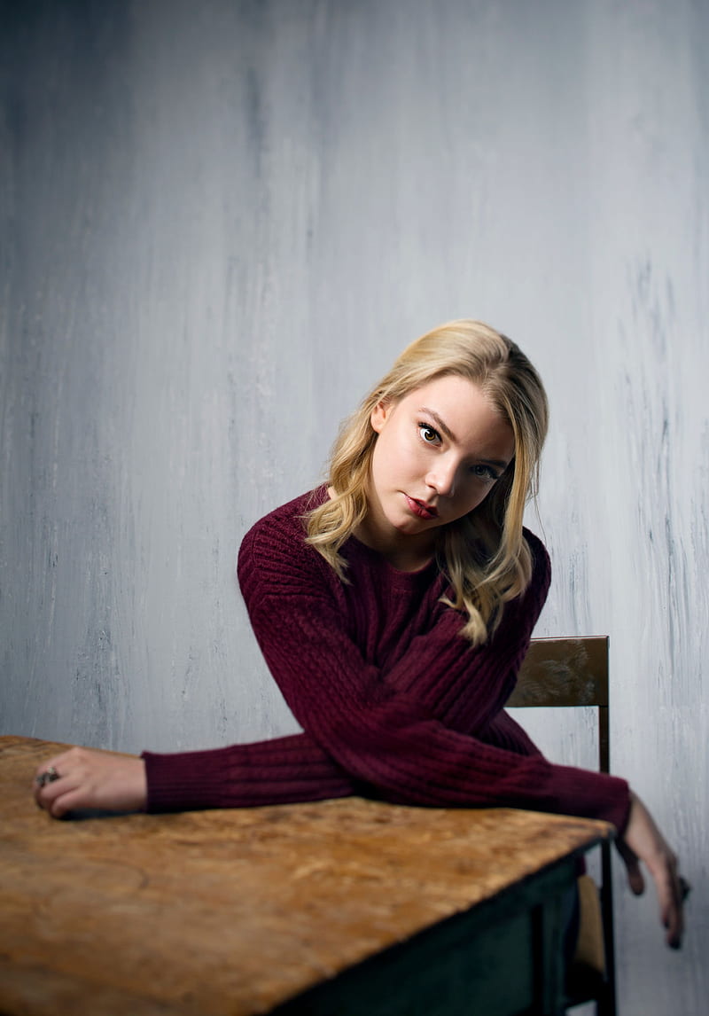 Anya Taylor-Joy , women, actress, blonde, sitting, simple background, HD phone wallpaper
