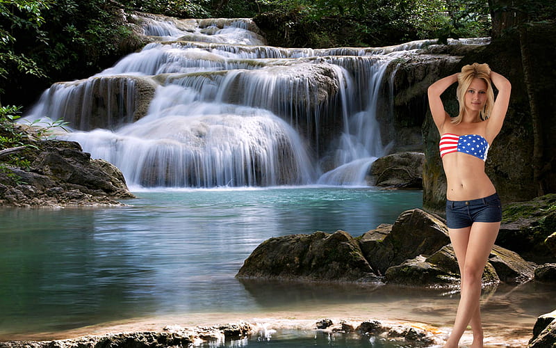 Couple posing near waterfall Stock Photo - Alamy